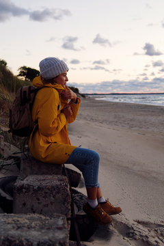 Woman feeling cold at seaside
