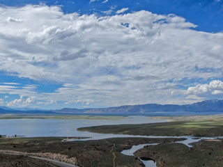 Aerial view of Lake Crowley over the mountain during blue summer day. Mono County, California, USA