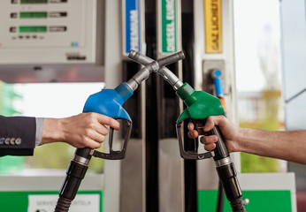 Crop hands crossing fuel nozzles