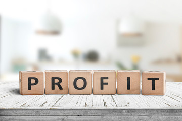 Profit sign in a bright room on a wooden table