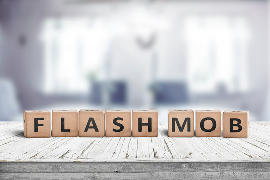 Flash mob message sign on a table in a bright room