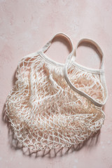 Empty reusable shopping bag on pink.