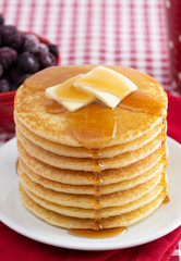 A Stack of Freshly Made Pancakes on a Gingham Tablecloth