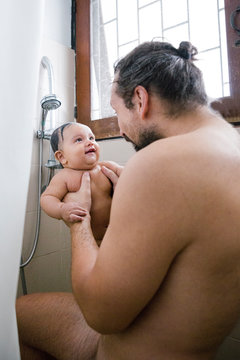 Father and Baby in Shower