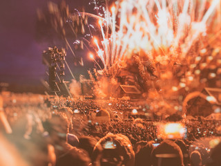 Low-fi double exposure of crowd and fireworks at a festival