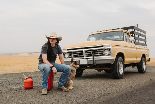 cowgirl on side of road out of gas