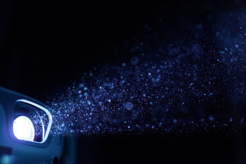 Bright projector light in darkness