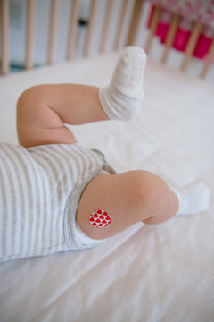 Baby Has Bandage Where She Received a Vaccination
