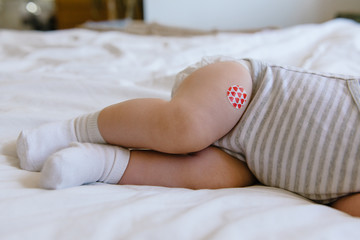 Baby Has Bandage Where She Received a Vaccination