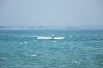 Obraz premium France. Normandie. Speedboat at the Atlantic ocean
