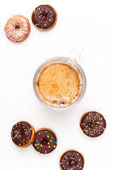 Donuts with chocolate and a cup of coffee on a white background. Delicious and vigorous breakfast.