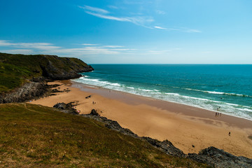 A sandy beach surrounded by cliffs (Pobbles, Gower, Wales)