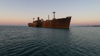 A shipwreck at the black sea shore on a clear morning.