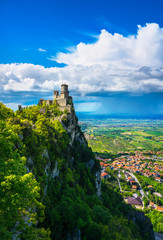 San Marino, medieval tower on a rocky cliff and panoramic view of Romagna - obrazy, fototapety, plakaty