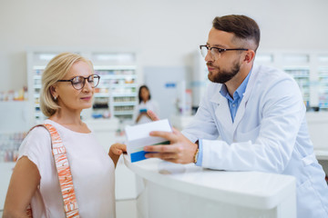 Fototapeta premium Cheerful mature client being in all ears