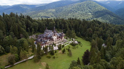 Aerial view of a castle in a forest on a sunny day!