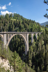 View from the historic Wiesen Viaduct of the Rhaetian Railway near the village Davos Wiesen, Swiss...