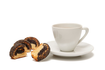Cookie with poppy seeds and white cup of black coffee on white background, isolated