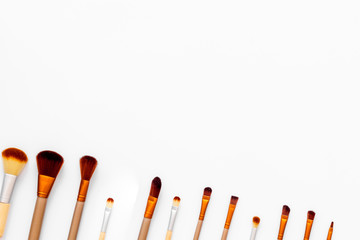 Instruments for make up with brushes on white background top view mock up