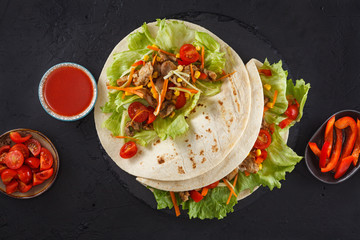 Meat and vegetables wraps.