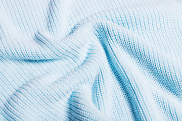 Fototapeta na wymiar Blue knitted soft background