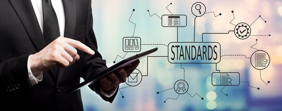 Standard quality control approval with businessman using his tablet computer