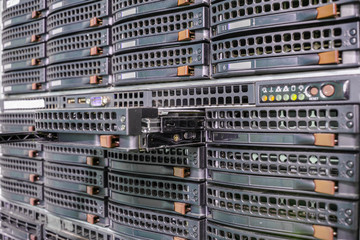 Replacing parts of computer equipment. Create a backup copy of the information. There are a lot of storage disks in the cloud farm.The slot for the hard disk in the data storage server is a close up