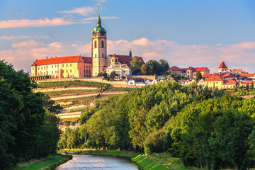 Panorama or skyline or cityscape of historical city Melnik with historical castle and river Vltava and famous vineyards. Melnik is 30 km north of Prague  - obrazy, fototapety, plakaty