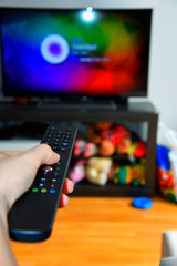 tv remote control in the hand