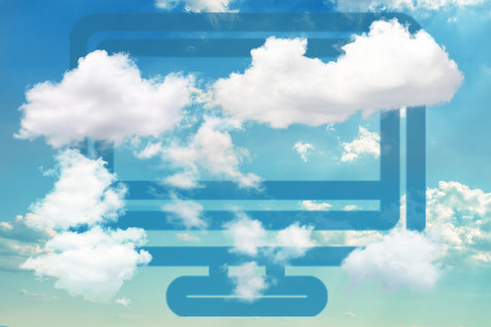 Blue Computer Icon On Dramatic Blue Sky Partly Covered With Clouds. Concept Of Cloud Computing And Other Modern Technologies.