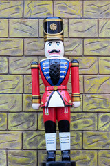 figure of a lead soldier on a colorful outdoor scenery