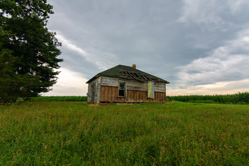 Abandoned farmhouse at sunrise