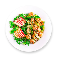 Nutritious healthy lunch dinner on white plate: shrimp scampi with spinach apple walnut salad. Top view. Isolated.