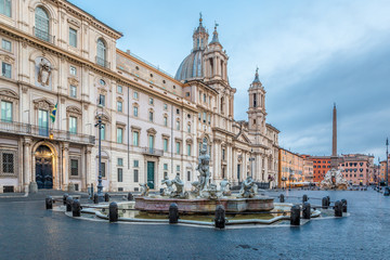 Fototapeta na wymiar The southern end of the ancient Piazza Navona with the Fontana del Moro (Moor Fountain) early in the morning after dawn with no people around in Rome, Italy, Europe