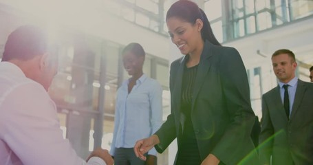 Businesswoman checking in at conference registration table 4k - Powered by Adobe