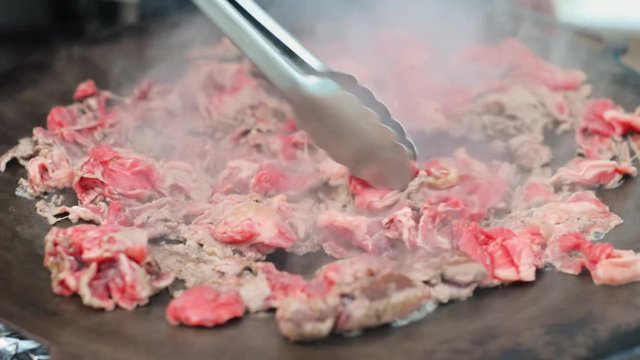 Red beef meat bbq fry  Philadelphia cheesesteak beefsteak top round pan close-up