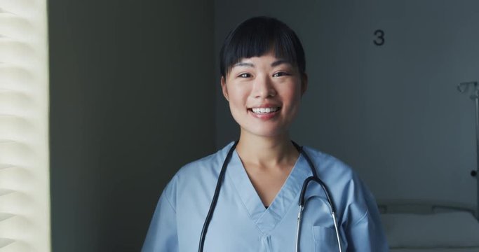 Young female doctor smiling to camera 4k