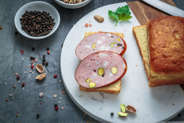 Sandwich with sausage on a marble board. Top view, copy space