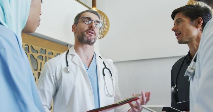 Doctors stand tallking in a meeting 4k