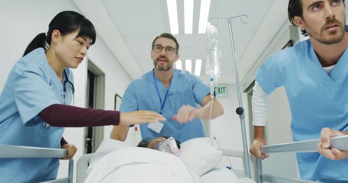 Hospital staff pushing patient in bed during an emergency 4k