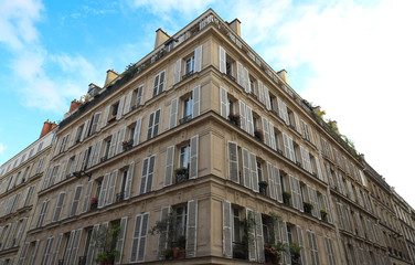 Traditional French house with typical balconies and windows. Paris.