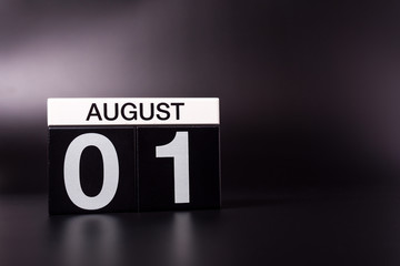 August 1st. Image of 1 august color calendar on black background. Summer day. Empty space for text