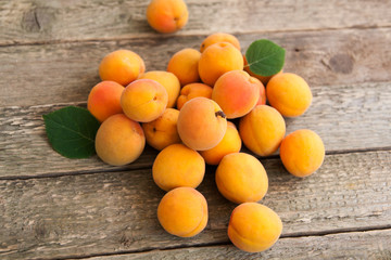 ripe apricots on a wooden table