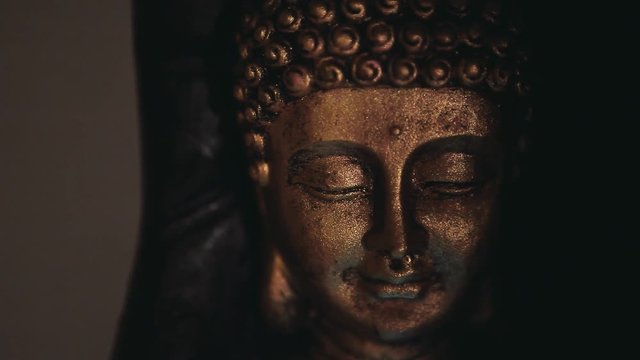 gold buddha face statue wall background  