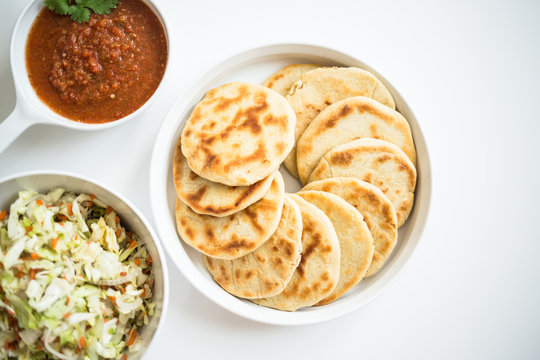 Pupusas from El Salvador with delicious salsa and curtido