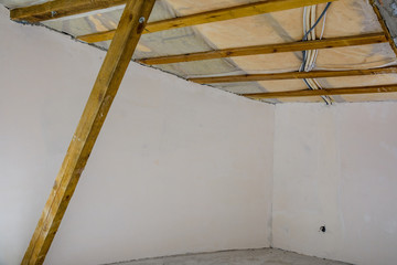 Construction of the roof in new residential building. View from inside