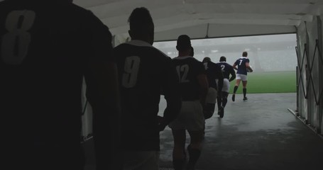 Male rugby players running together in a row at the entrance of stadium 4k - Powered by Adobe