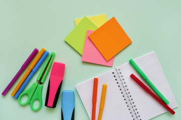 School subjects on green background. Back to school concept. Flat lay, copy space