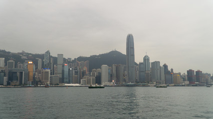 Naklejka premium Hong Kong, China - City skyline over important Victoria Harbour, skyscraper-studded skyline.