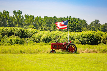 Symbols of American farming: tractor and flag